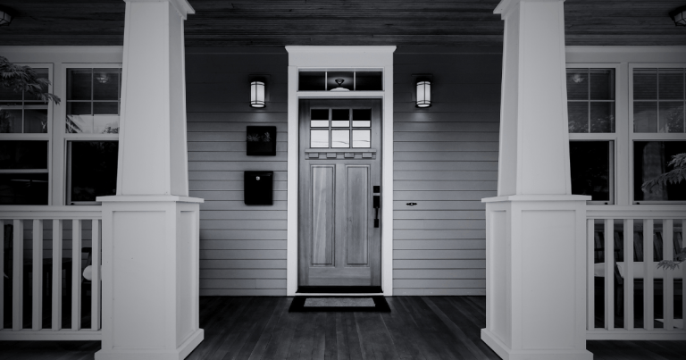 A spooky front door to a home.